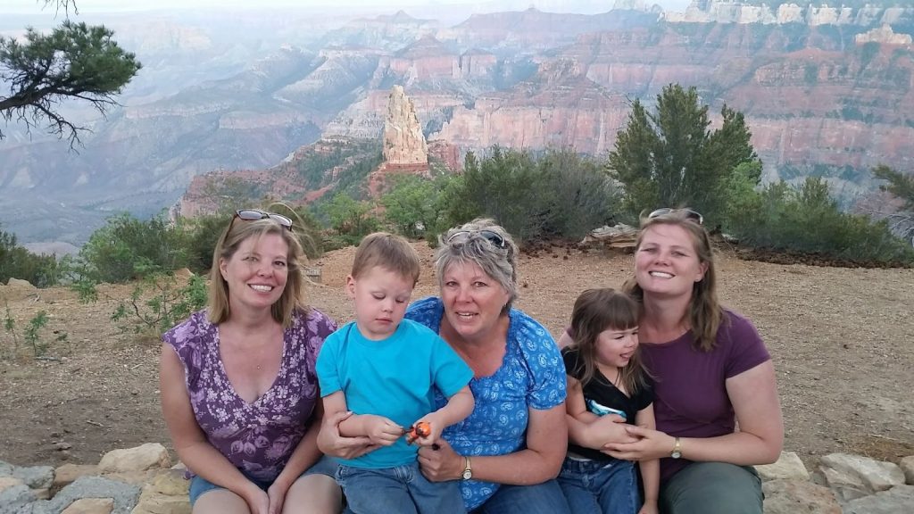 Grandparents and grandchildren standing together at a Bryce Canyon overlook during a family spring break trip, showing multi generation spring break travel